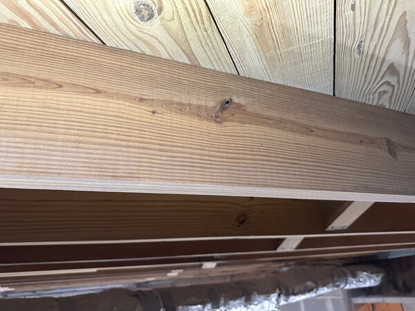 Same joists after soda blasting — clean, bright wood